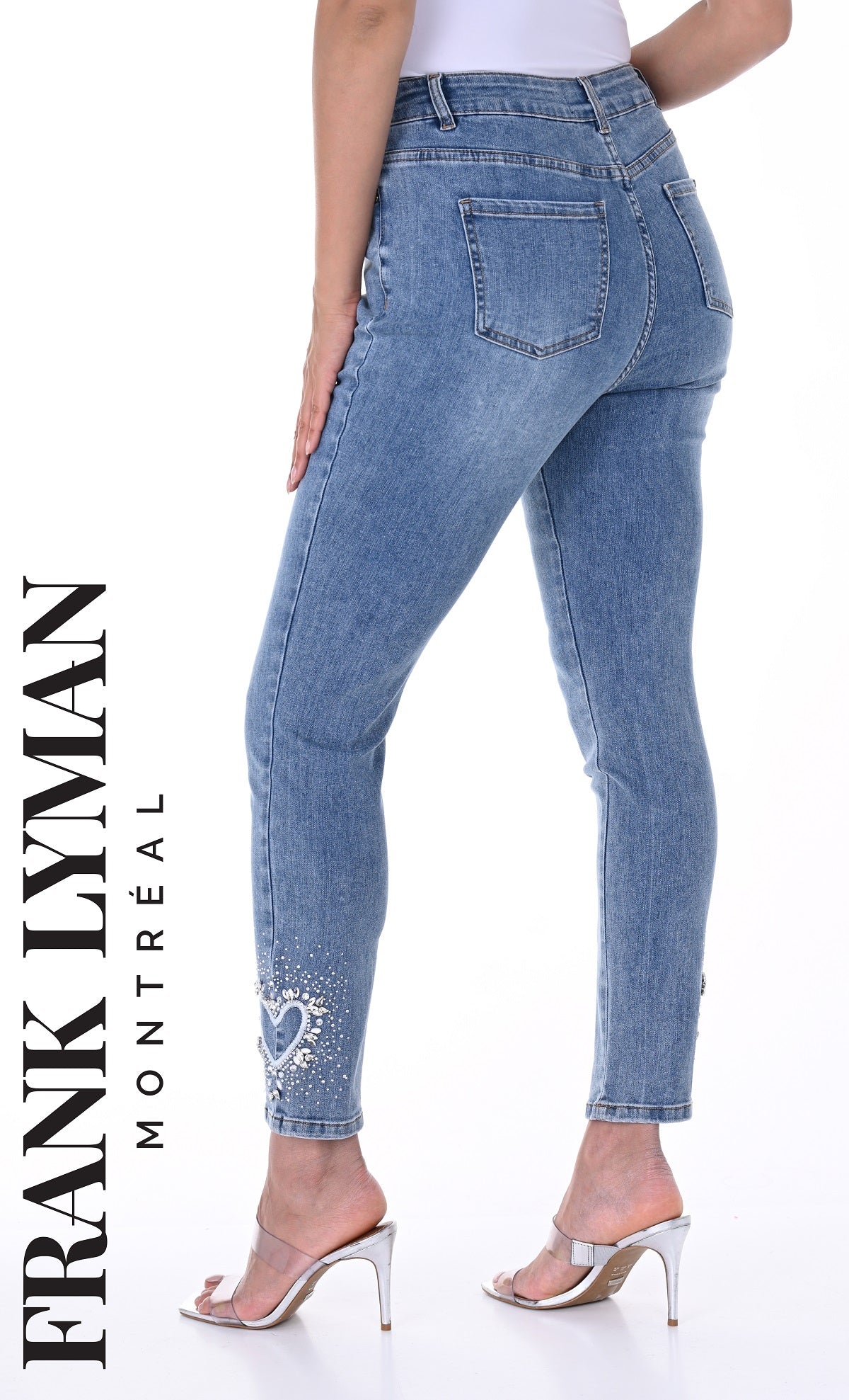 Denim blue jeans with crystal stone heart detail on hem