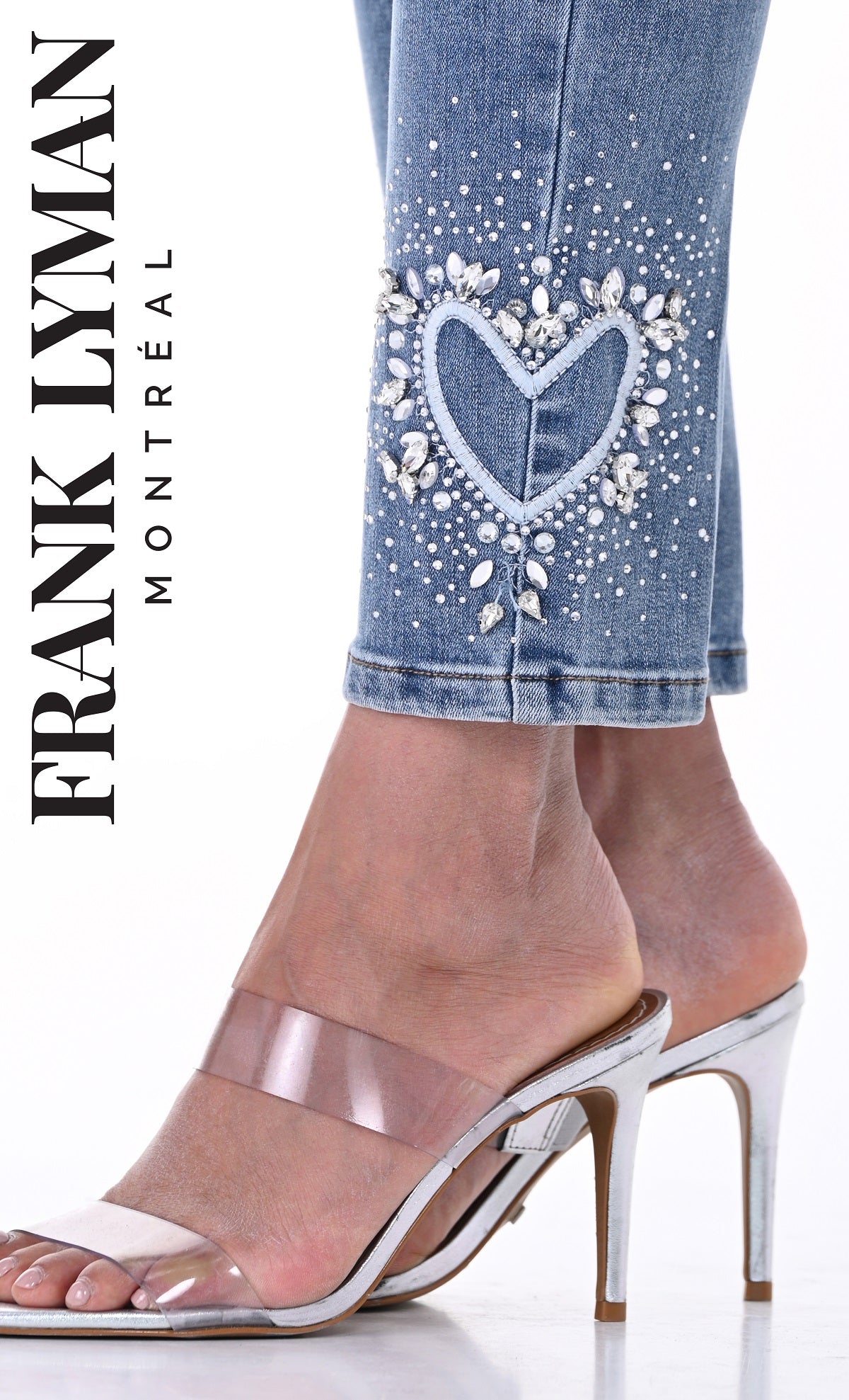 Denim blue jeans with crystal stone heart detail on hem