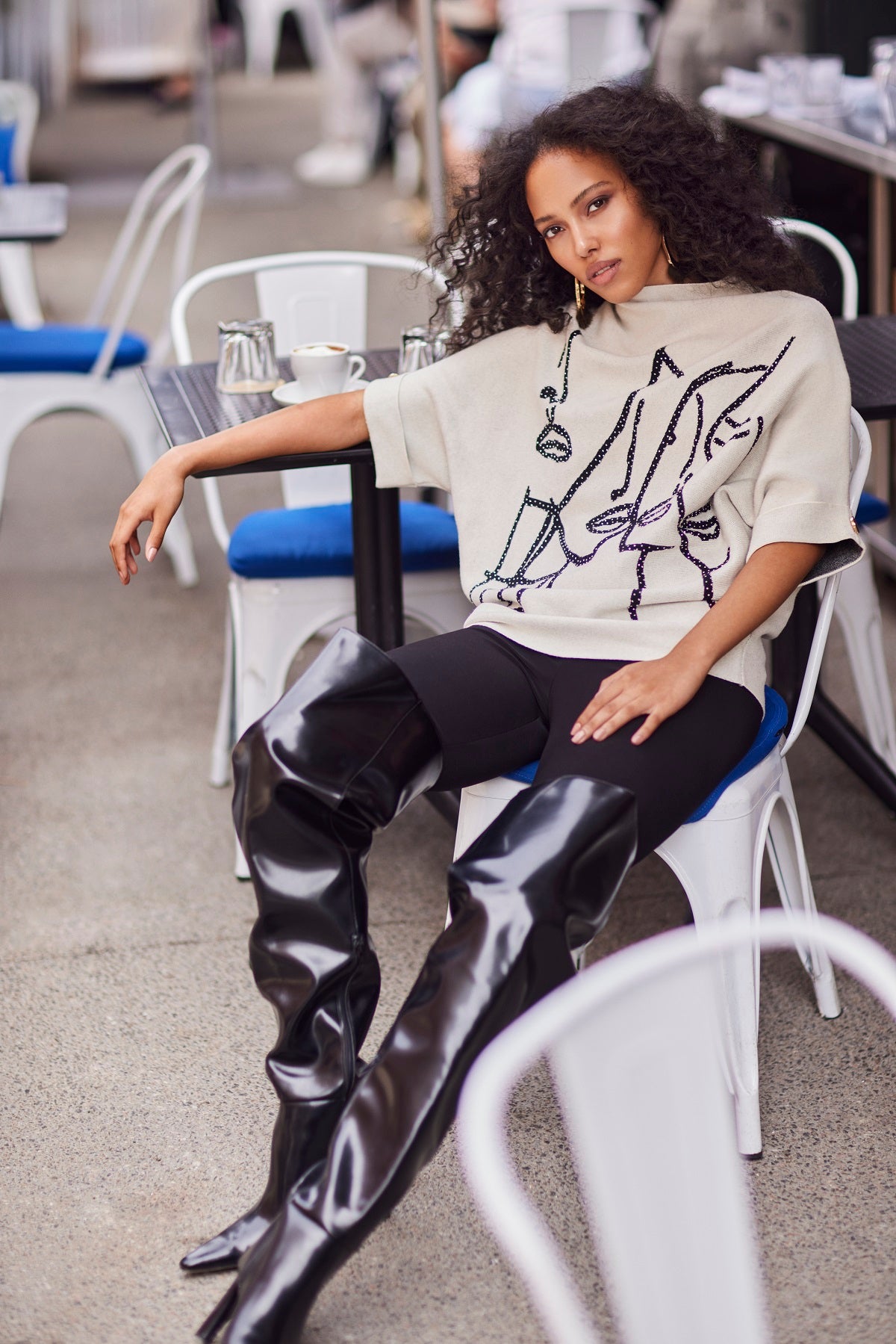 Beige black mock neck sweater with front sequin print detail