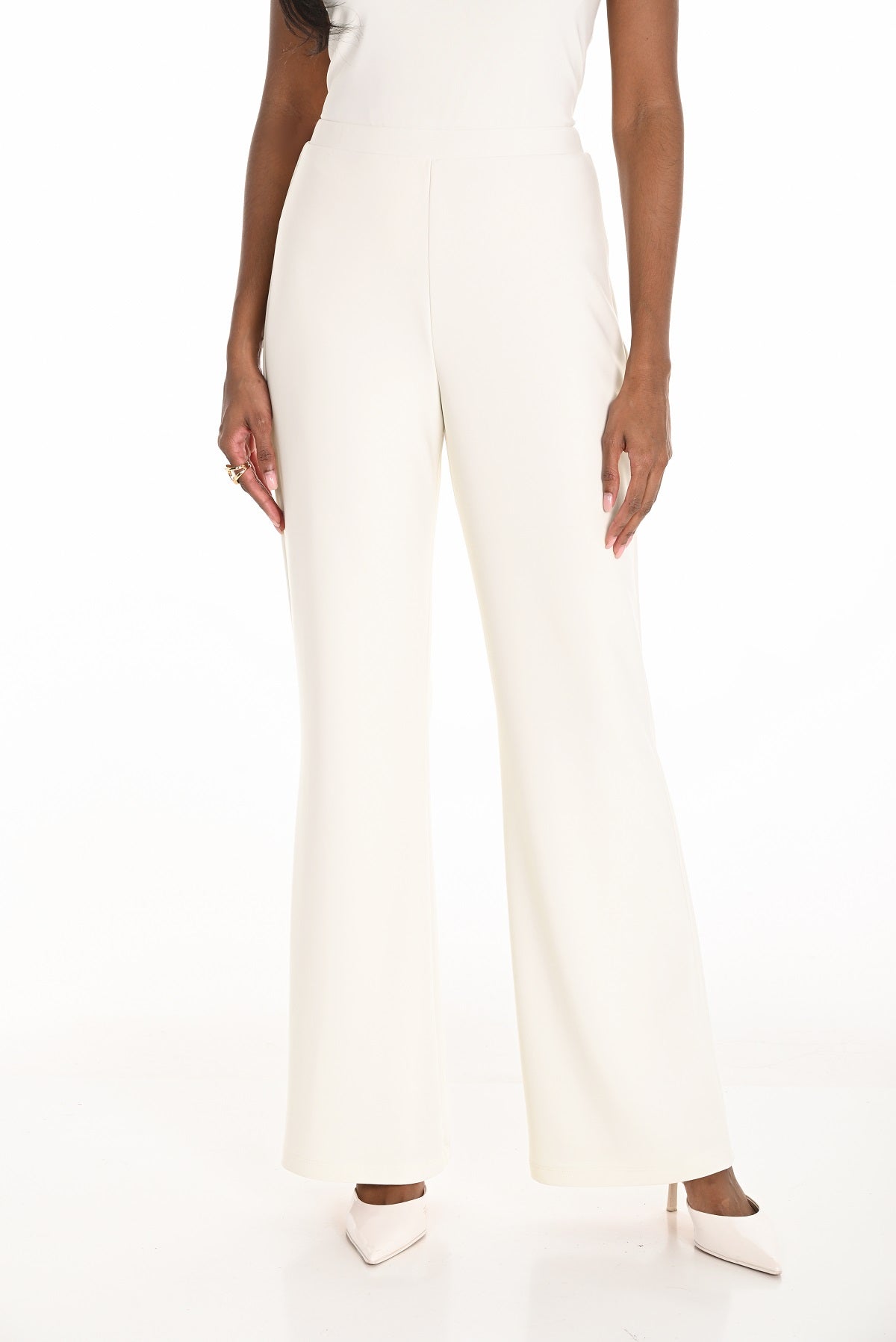 Off white premium knit evening pant with flare and pull on waistband.