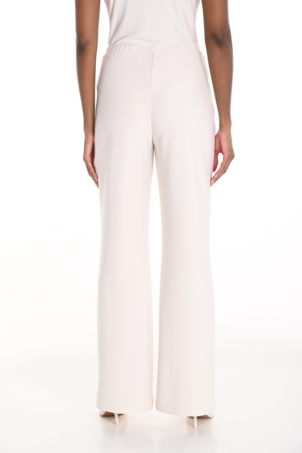 Off white premium knit evening pant with flare and pull on waistband.