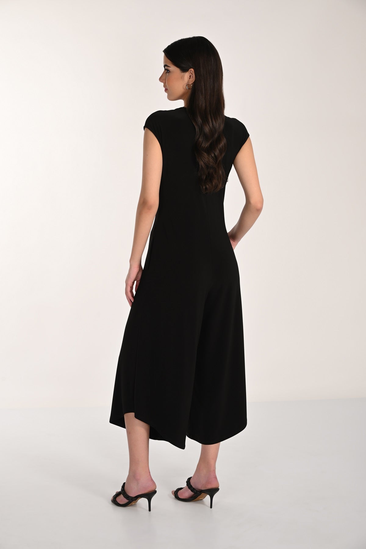 Black cap sleeve knit jumpsuit with wide leg and embellished front zipper