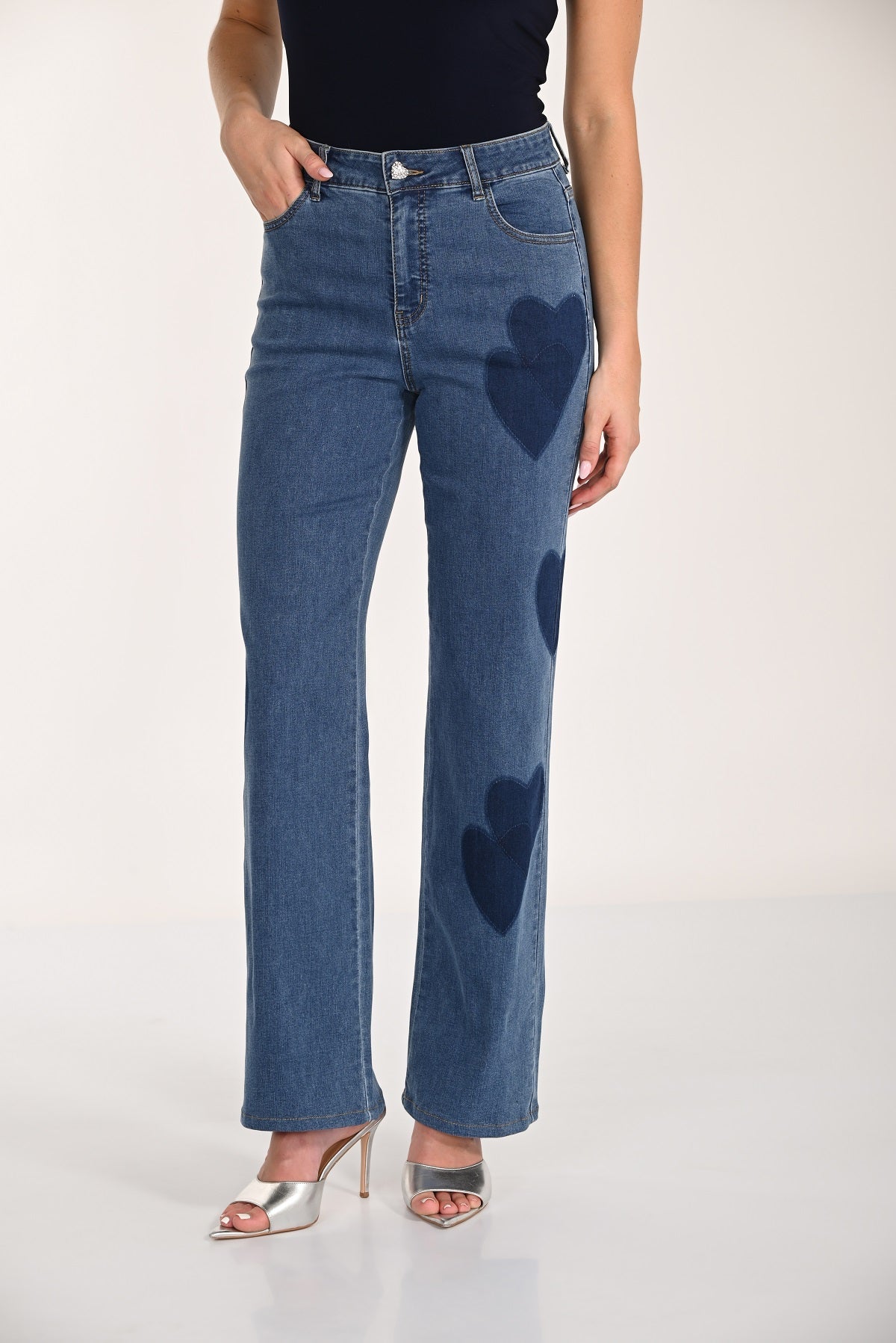Wide leg high rise blue jeans with heart patch detail on front