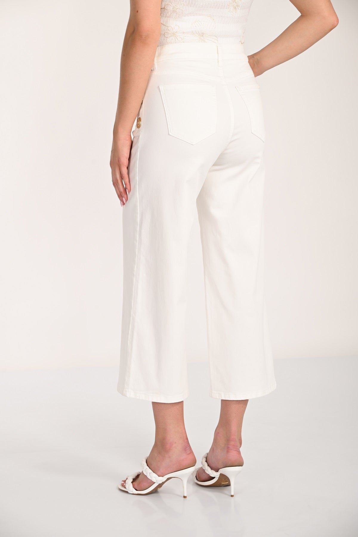 Off white cotton wide leg cropped jeans with side button detail