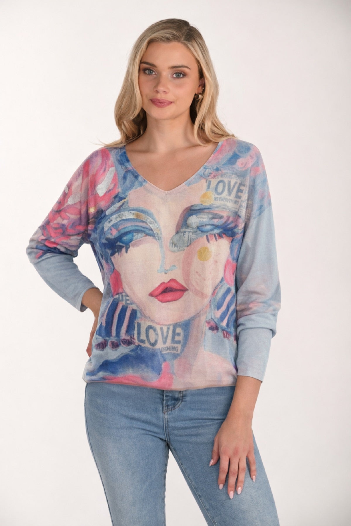 Lightweight knit sweater with fashionista print on front and back. V neck in blue pink
