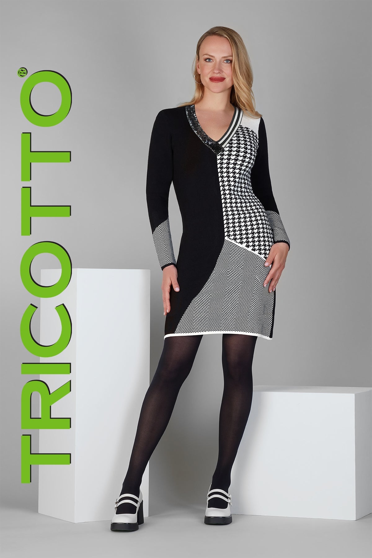 Tricotto Black and white dress with v neck sequin detail on front.
