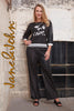 Black white lightweight polyurethane top with front sequin print detail