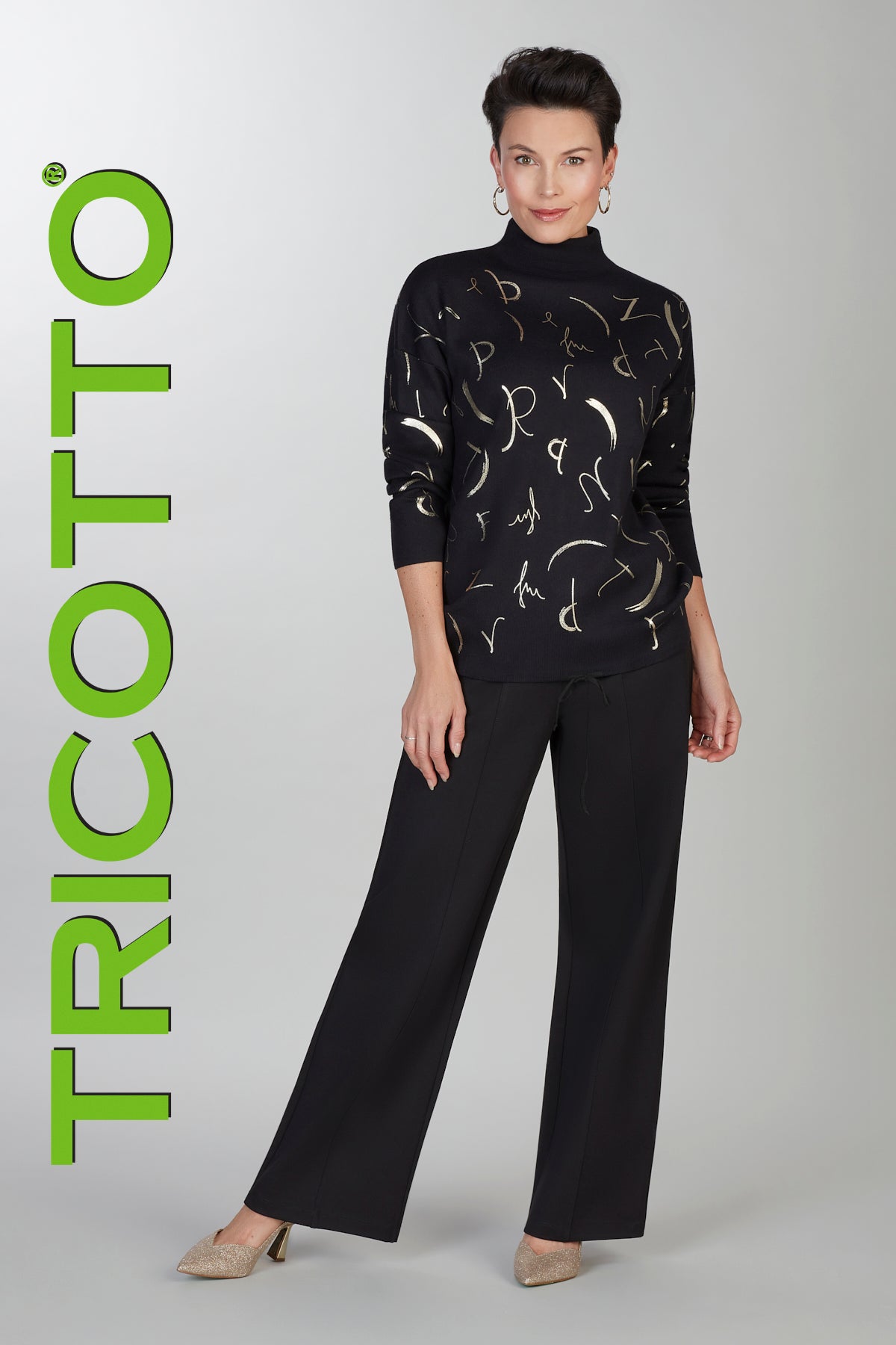 Black mock neck sweater with gold accent print detail on front & back