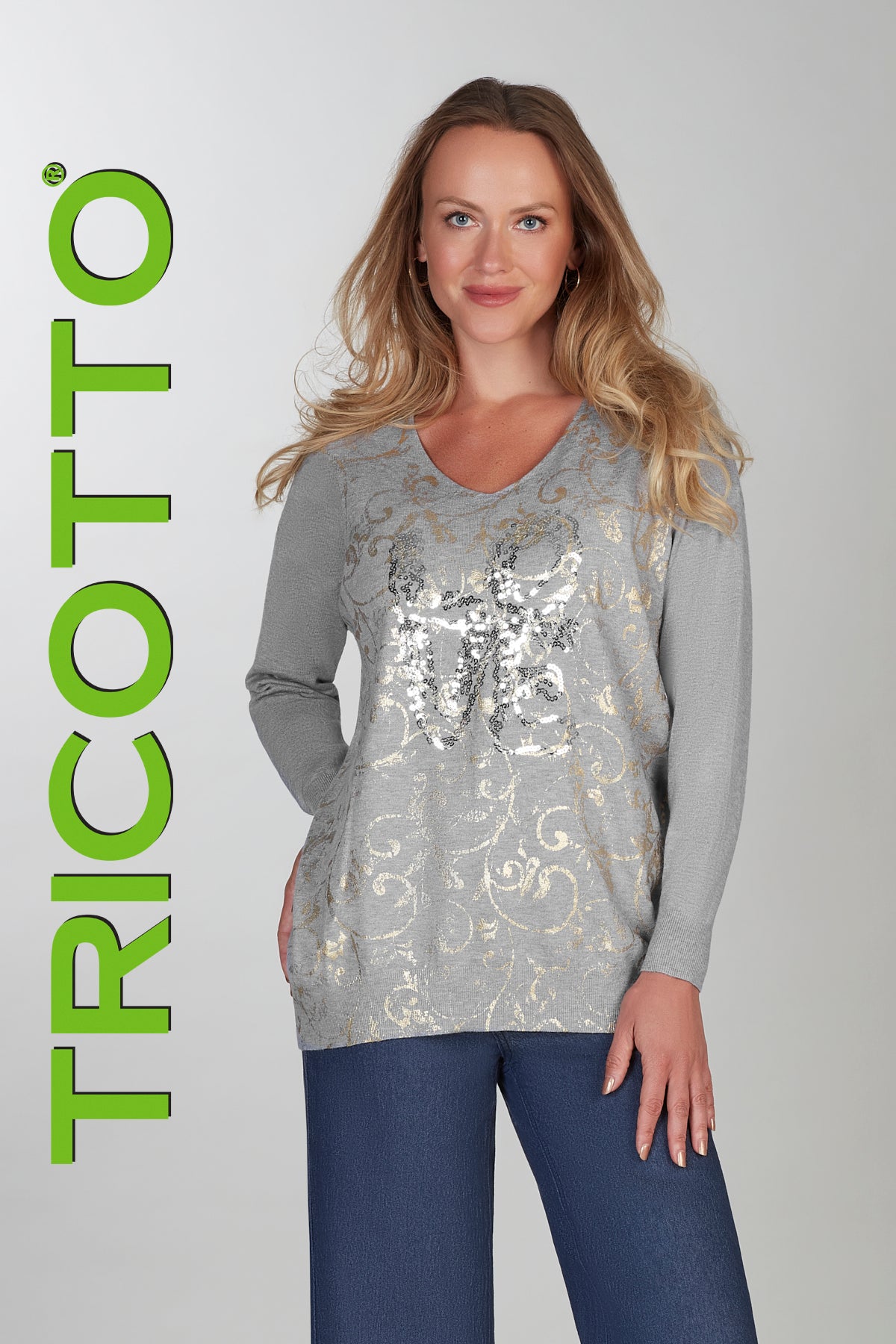 Grey tunic length sweater with front sequin and gold accent details