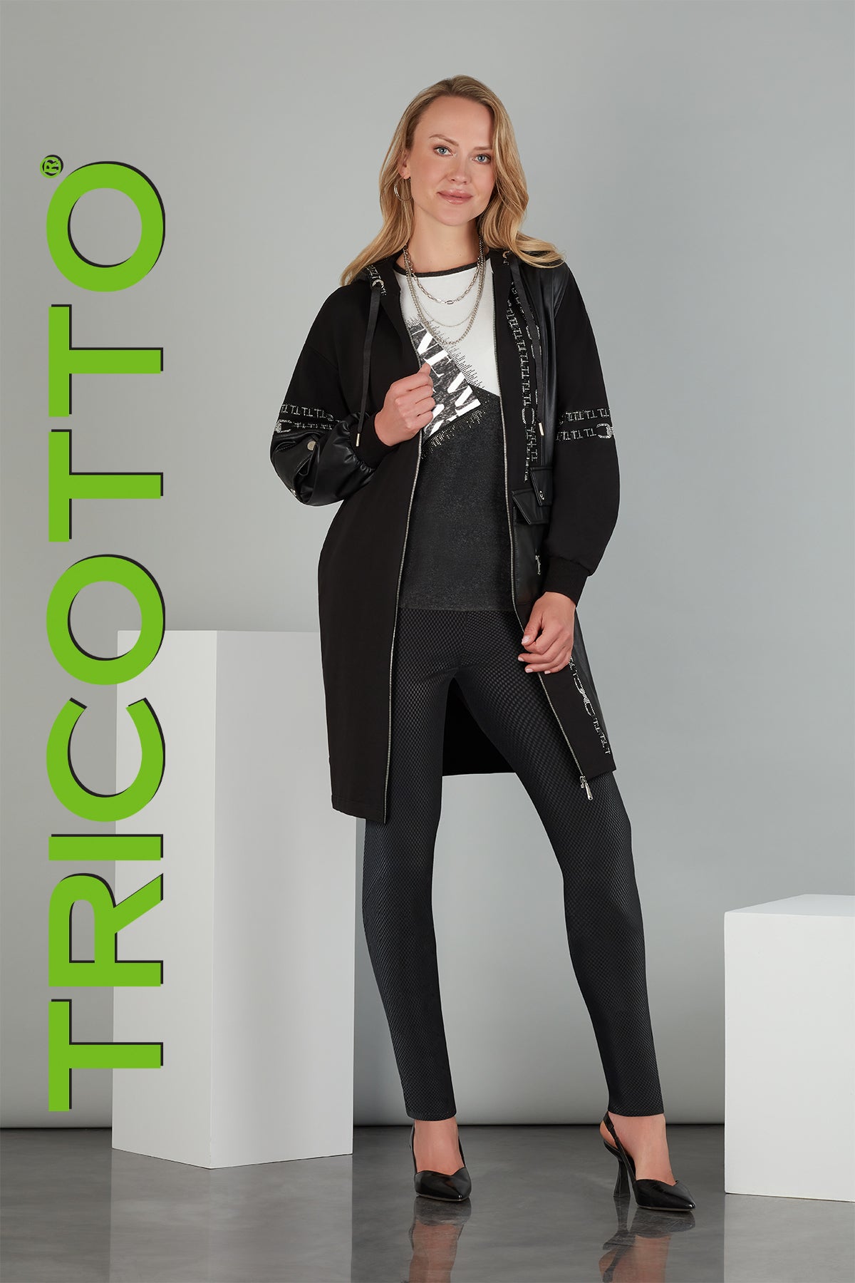 Tricotto Sequin Hoodie dress or cardigan with striking front silver sequin and polyurethane detail. 