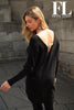 Frank Lyman Black Tunic sweater with back silver sequin knot detail and dolman sleeve.