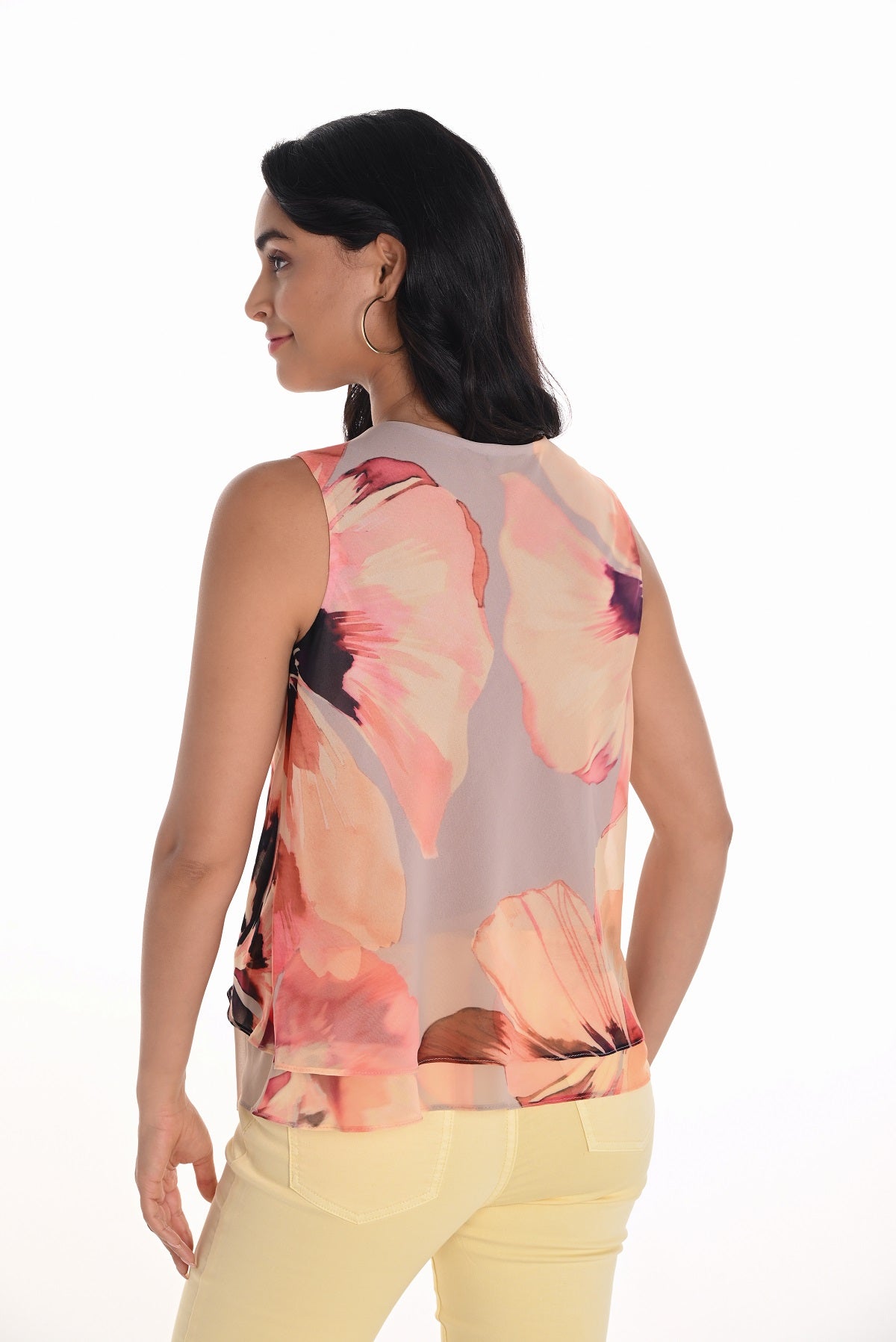 Frank Lyman sleeveless woven knit a line top in beige pink print.