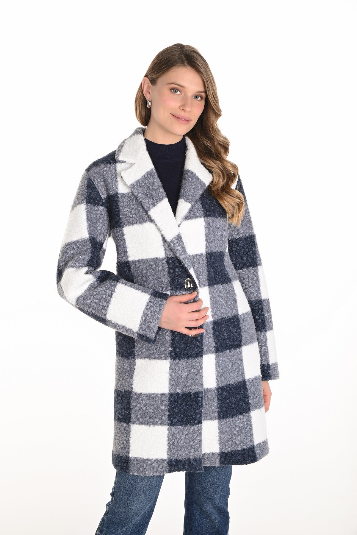 Woman wearing a checkered coat on a white background