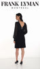 Woman wearing a black dress with sheer sleeves by Frank Lyman Montreal on a white background