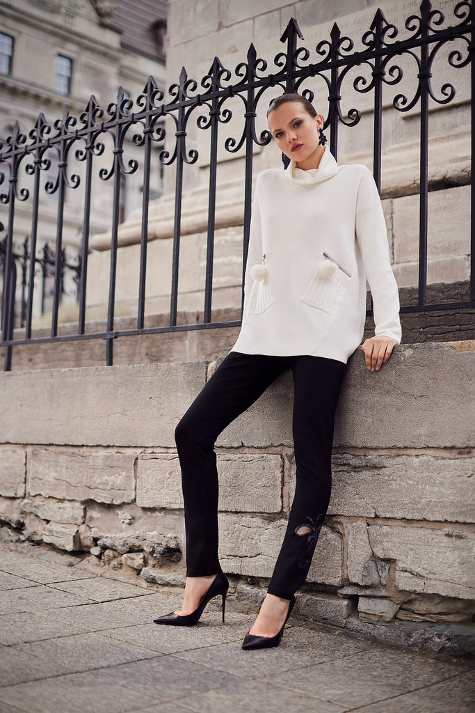 Winter white tunic sweater with mock neck and zippered pom pom pockets