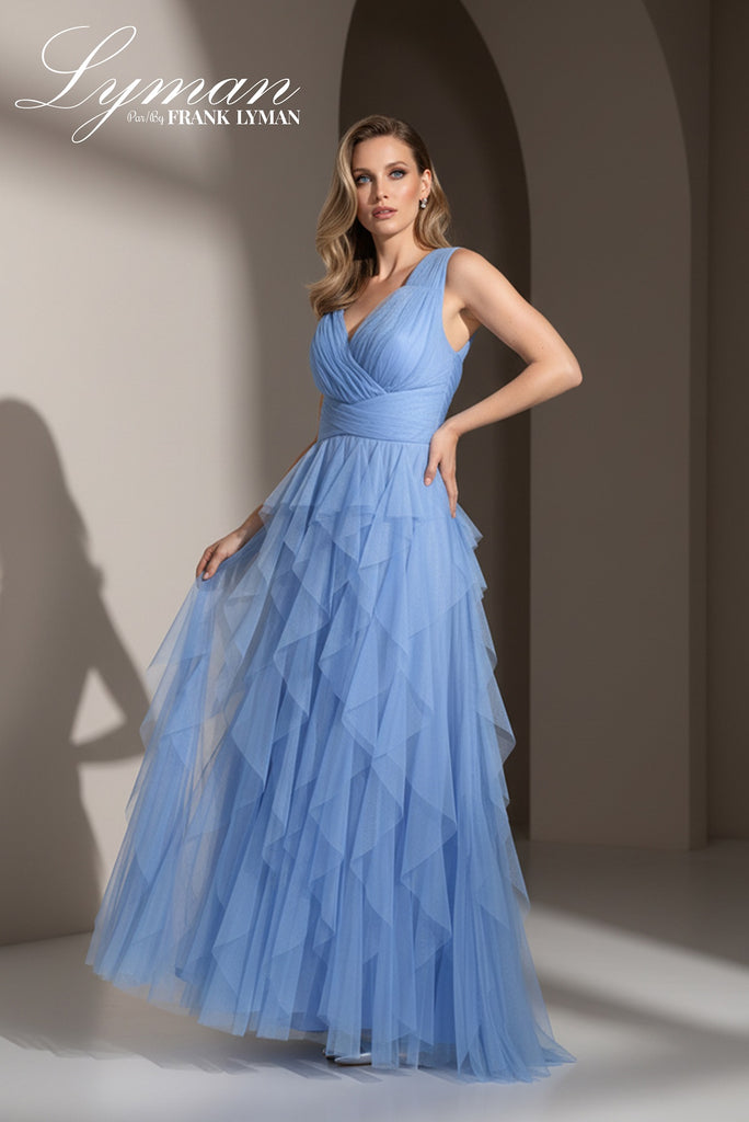 Woman wearing a blue evening gown with 'Lyman' branding in the corner.