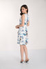 Woman wearing a floral dress on a white background