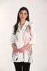 Winter white tunic length blouse with front print and accent detail