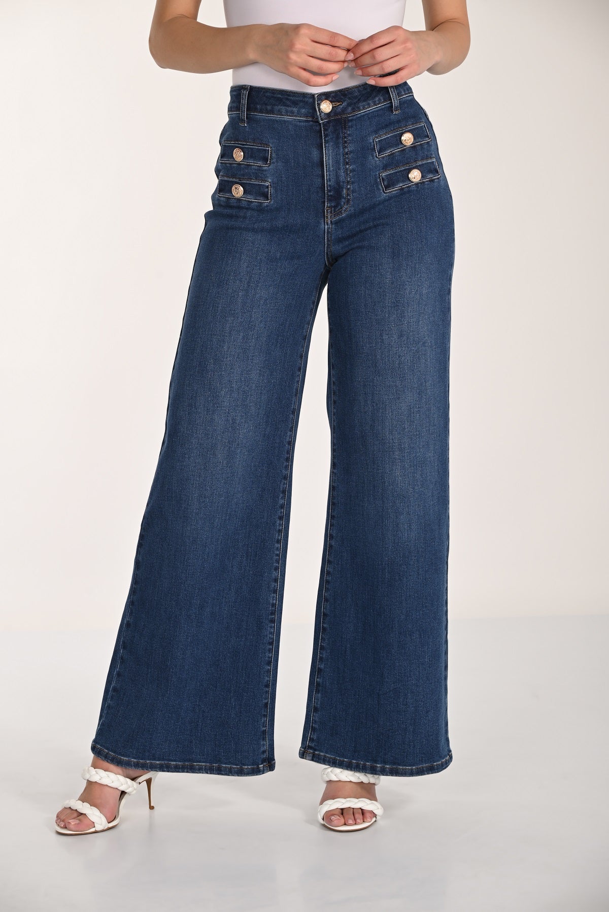 Wide leg high rise jeans with gold button detail in 32 inch inseam.