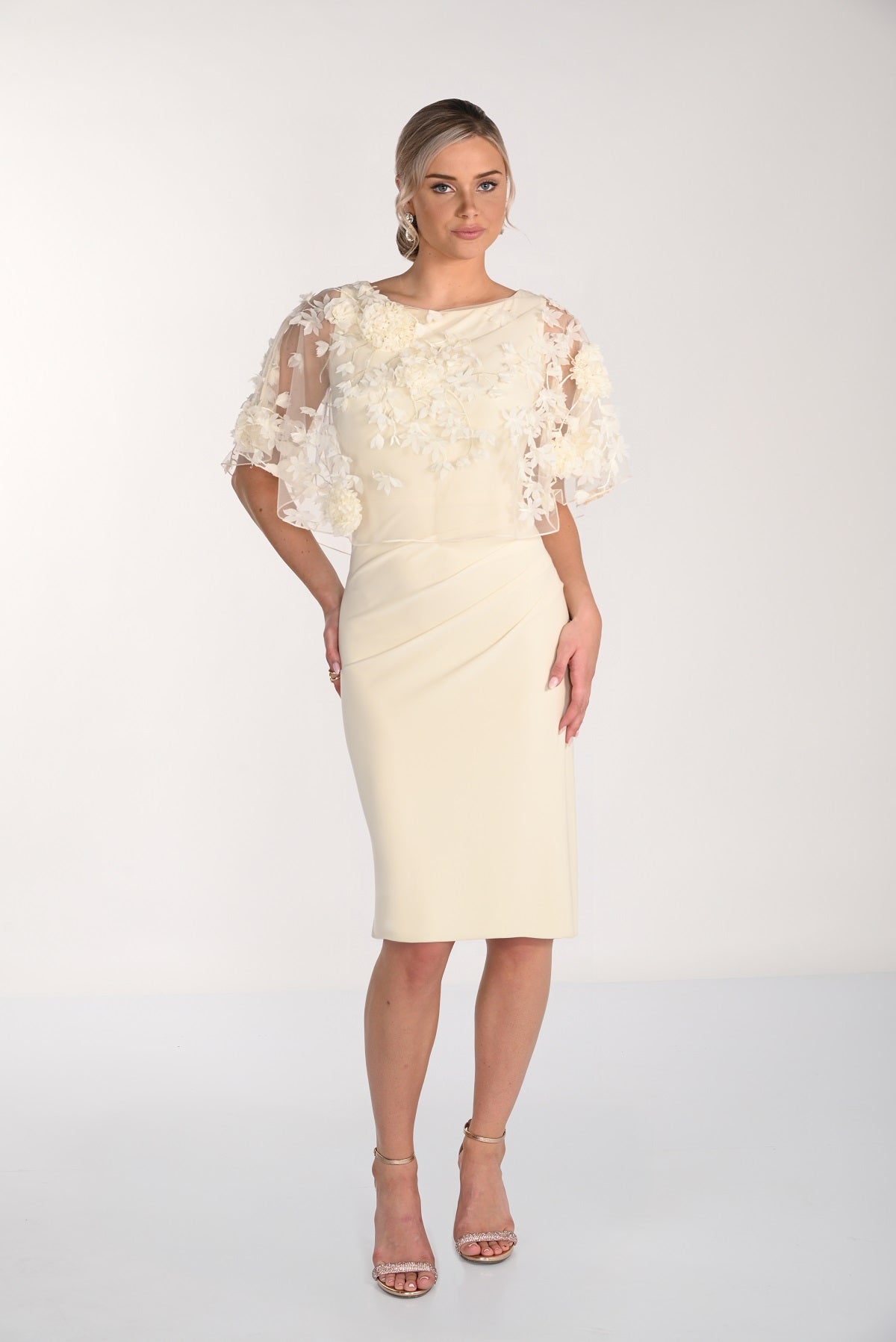 Made In Canada Cocktail dress with fit flattering side cinch and attached floral embroidered overlay in custard color.