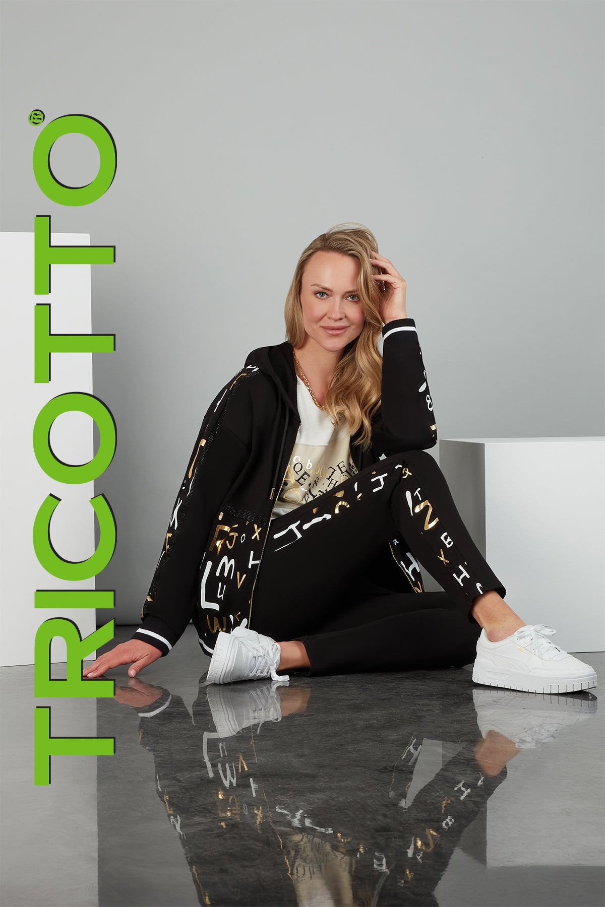 Tricotto Black relaxed cotton knit jogging jacket with front print and sequin detail