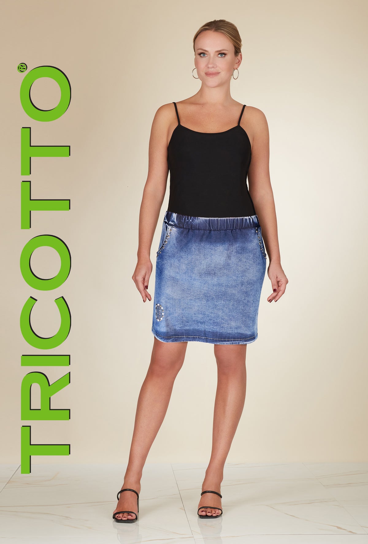 Tricotto Short Skirt with embellished pockets and elastic pull on waistband.