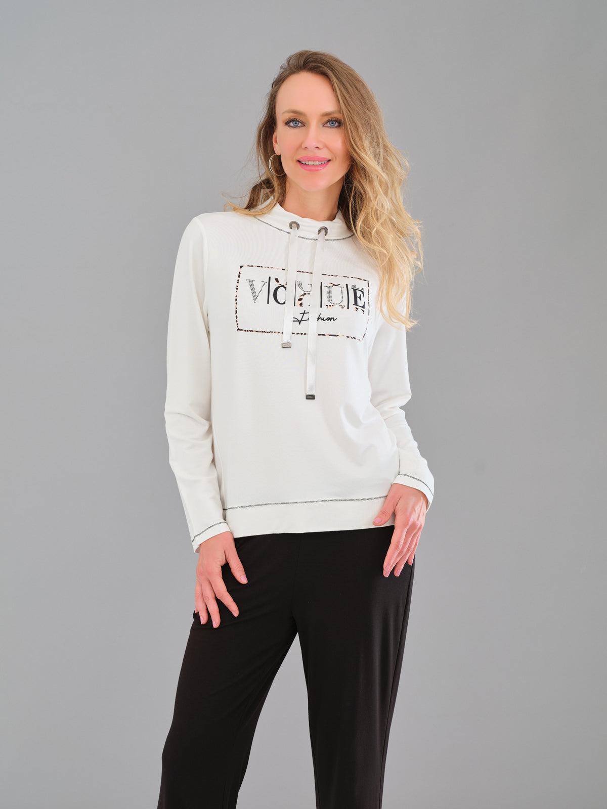 Woman wearing a light gray hoodie with text on a gray background