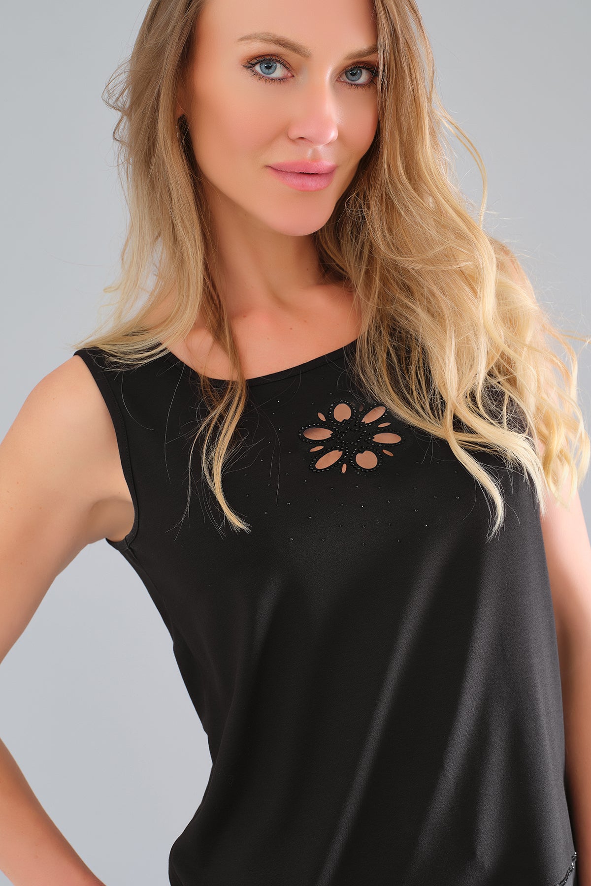Sleeveless black tunic length black top with front sequin detail