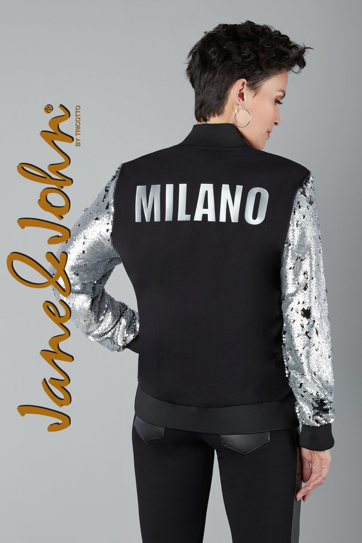 Two Tricotto (Jane & John) black mesh jackets, one with gold trim