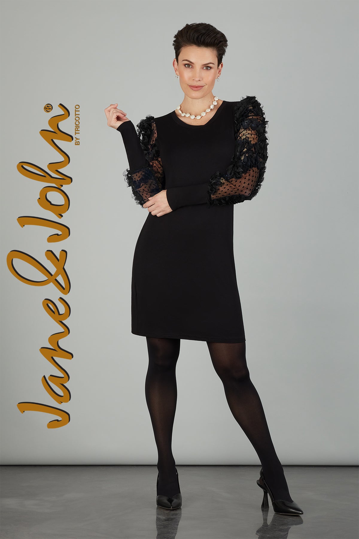 Tricotto Black dress with sheer arm detail