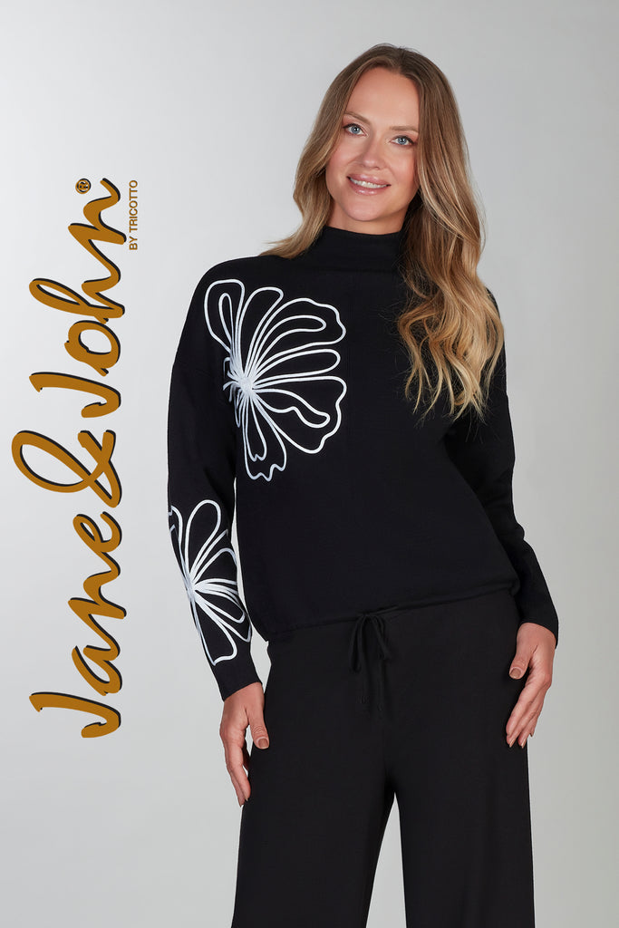 Black sweater with front floral accent detail
