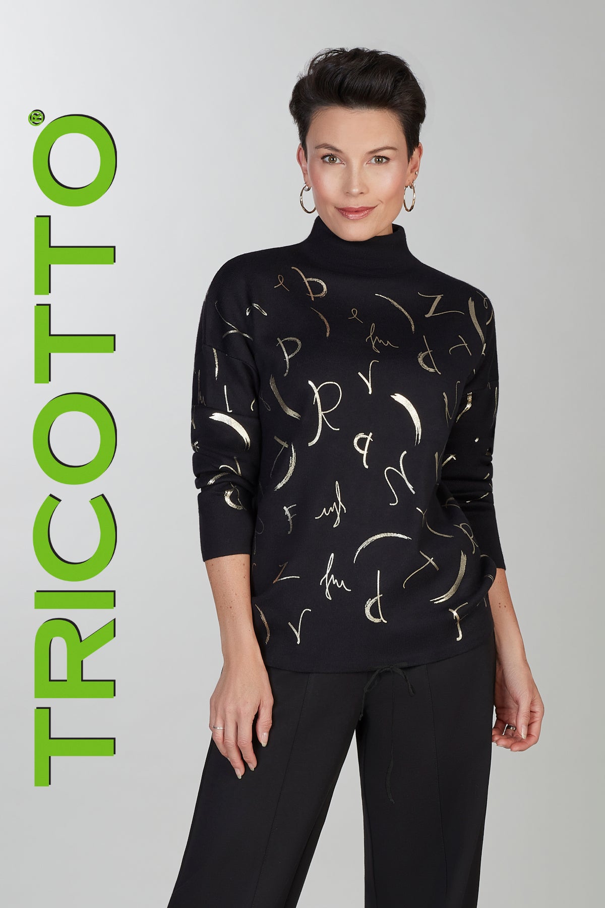 Black mock neck sweater with gold accent print detail on front & back