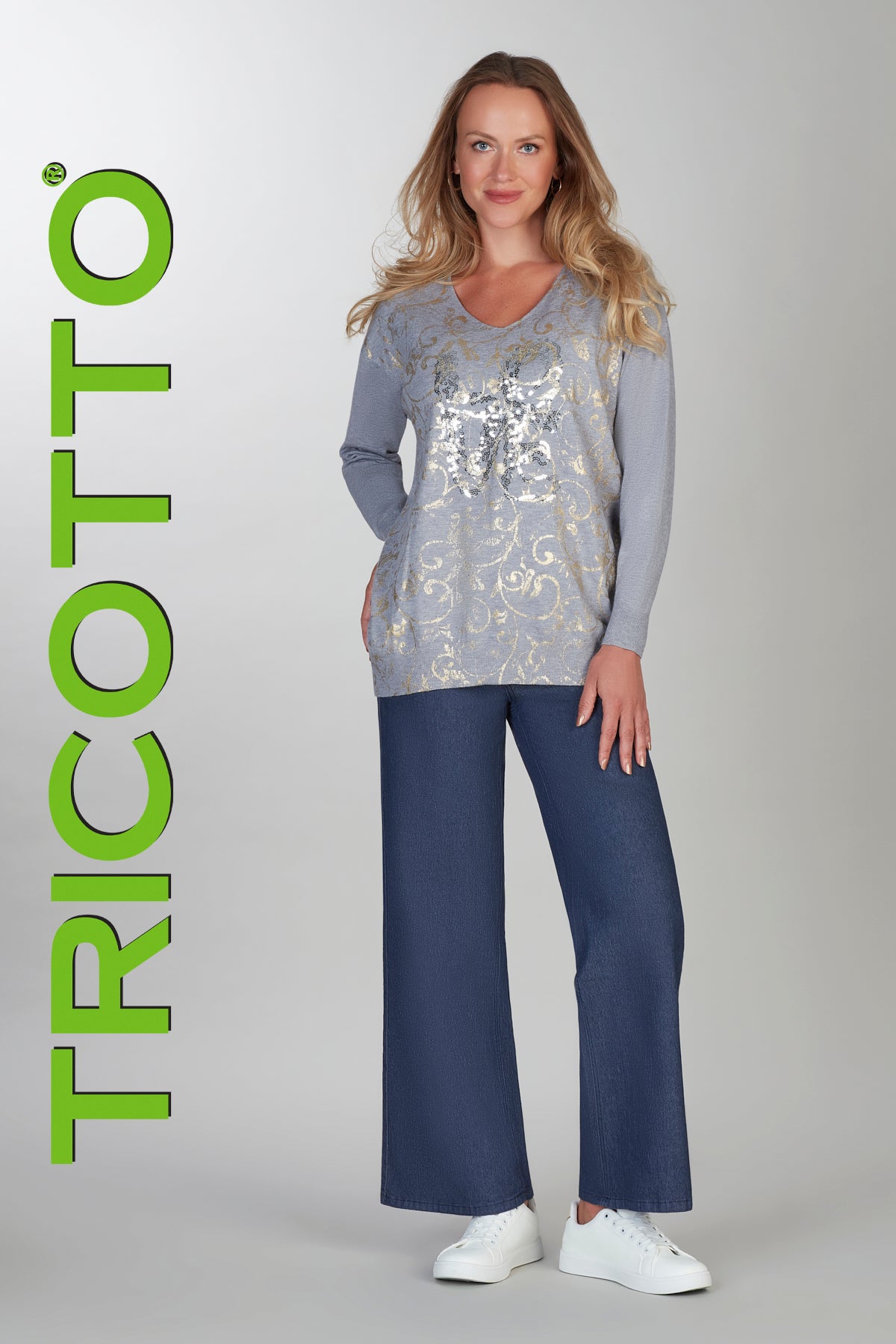 Grey tunic length sweater with front sequin and gold accent details