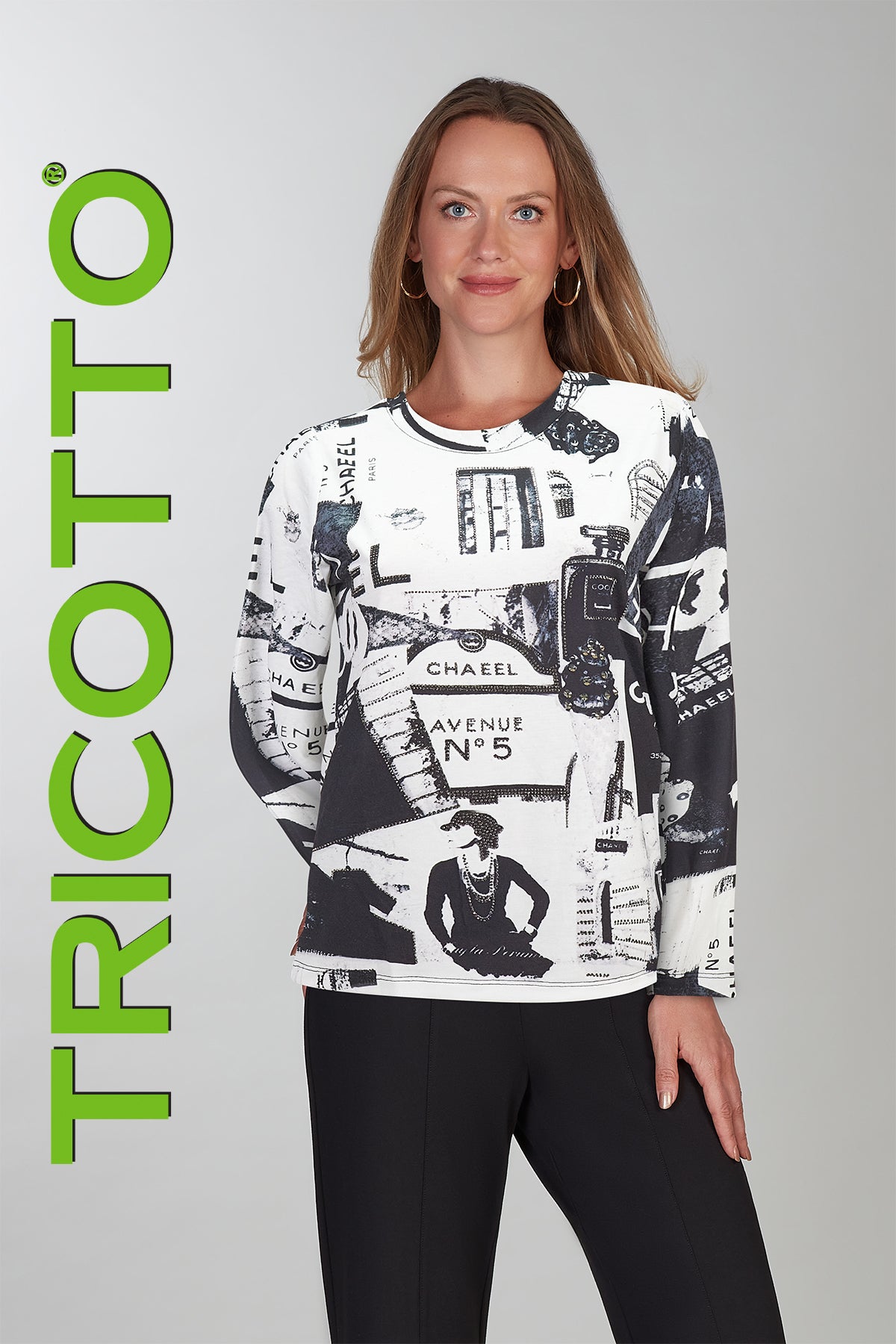 Woman wearing a black and white patterned long-sleeve shirt with 'TRICOTTO' branding on a gray background.