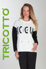 Woman wearing a white hoodie with black text and sleeves, standing against a light gray background with 'TRICOTTO' branding.