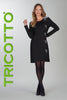 Woman wearing a black dress with butterfly details, standing against a white background with 'TRICOTTO' branding.