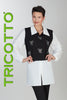 Woman wearing a black vest with white bow patterns and a white blouse, with 'Tricotto' branding on a gray background.