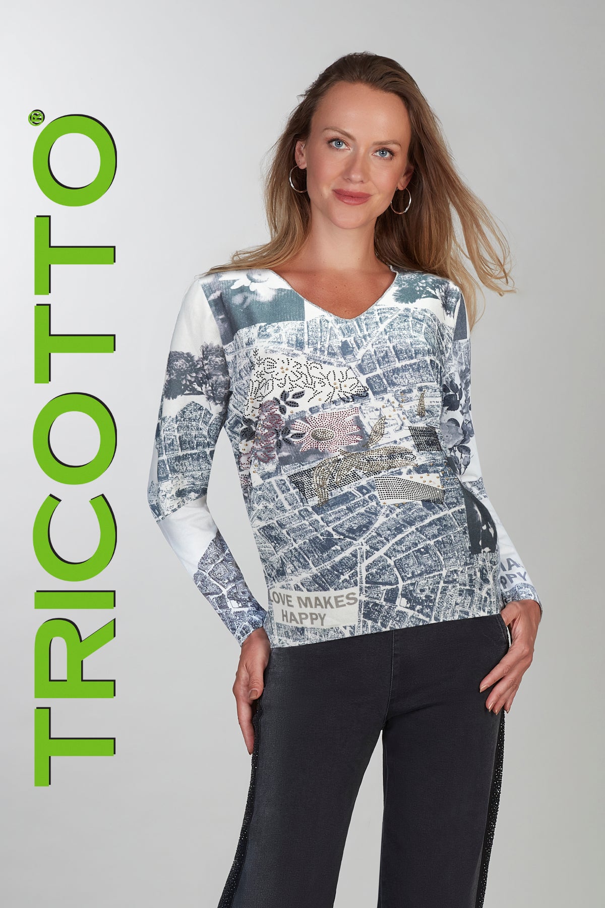 Woman wearing a patterned long-sleeve top with 'Tricotto' branding on a gray background
